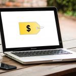 Notebook with a dollar sign on the screen